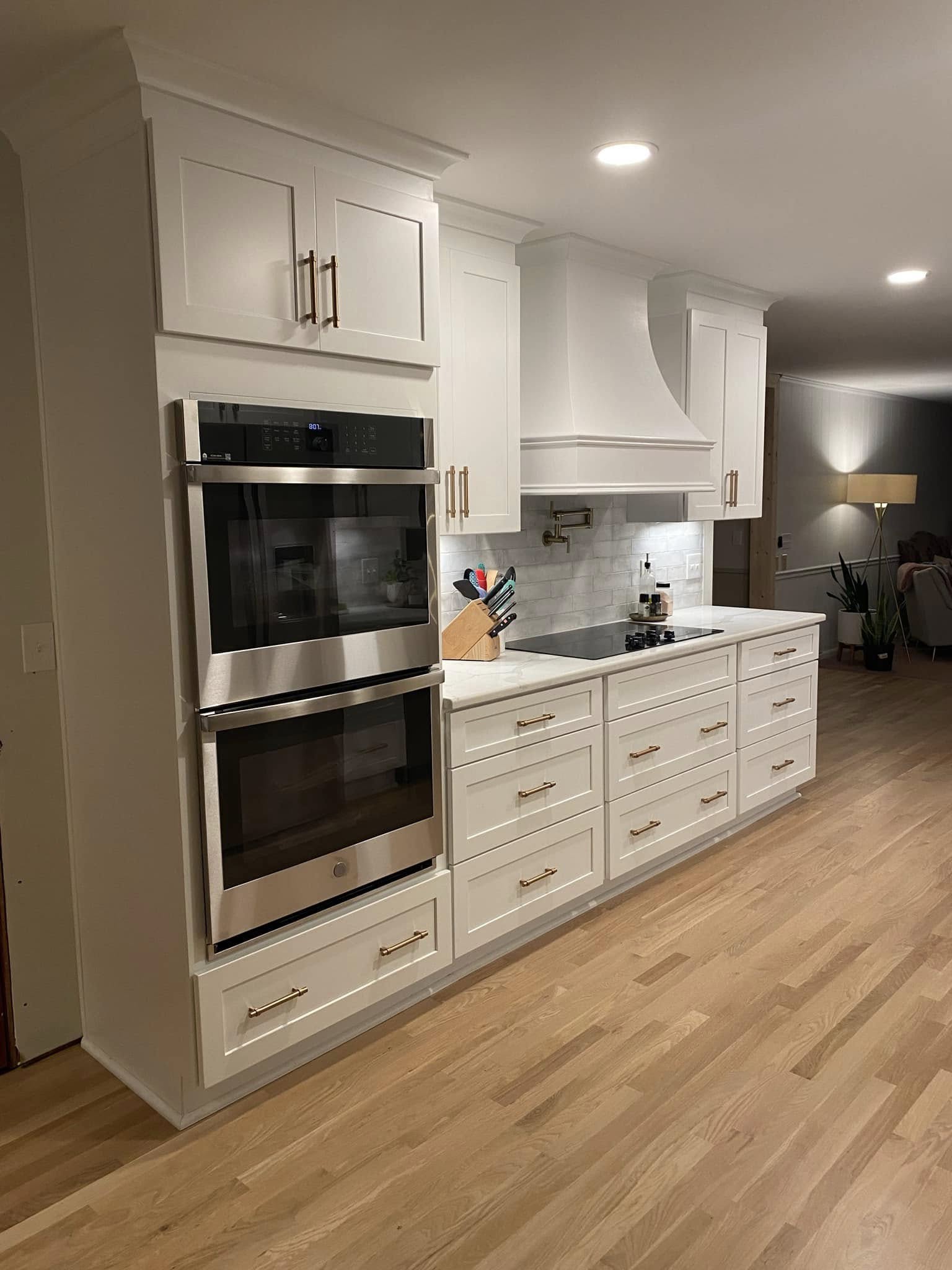 White kitchen cabinetry and hardware after the renovation